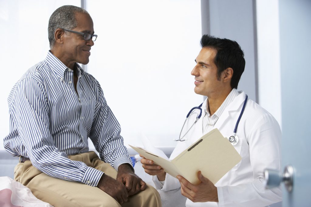 42256499 xl Doctor In Surgery With Male Patient Reading Notes 1 - Arizona's Leading Liver Clinic